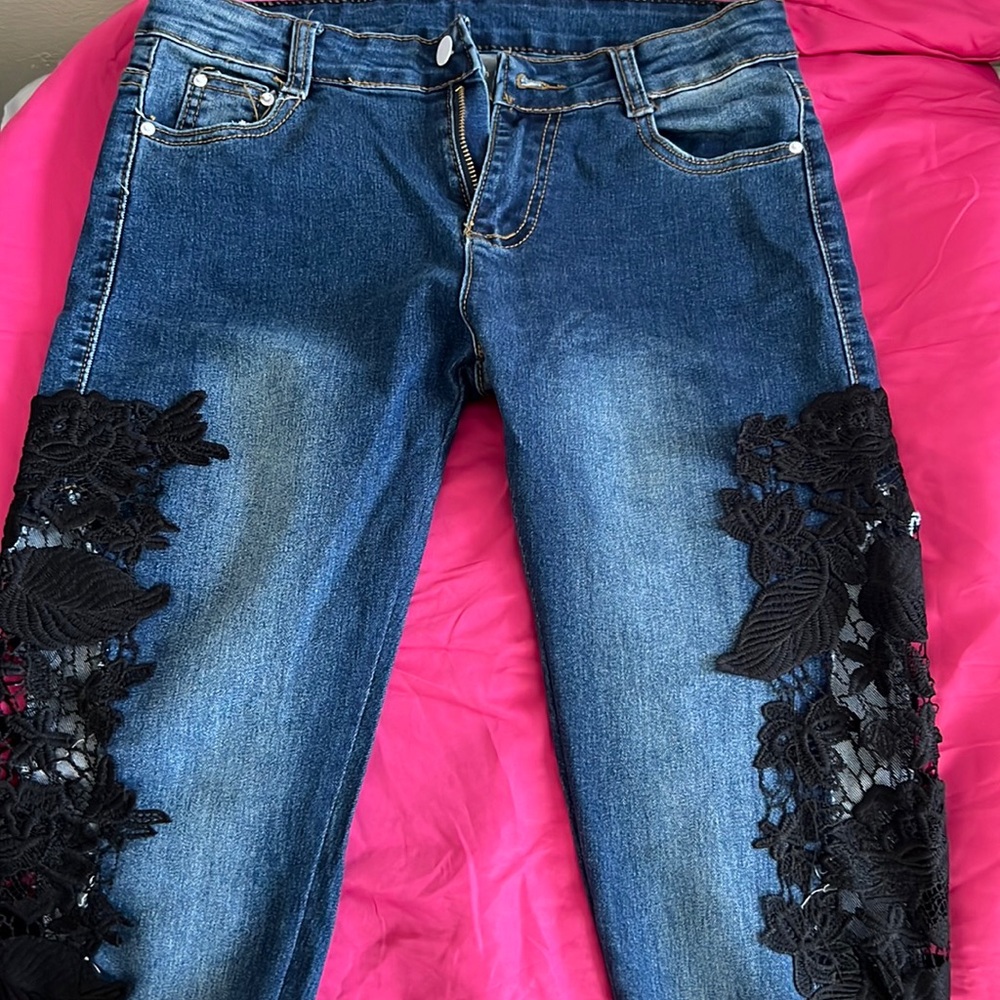 Dark blue beans with black lace from the hip to the ankles
